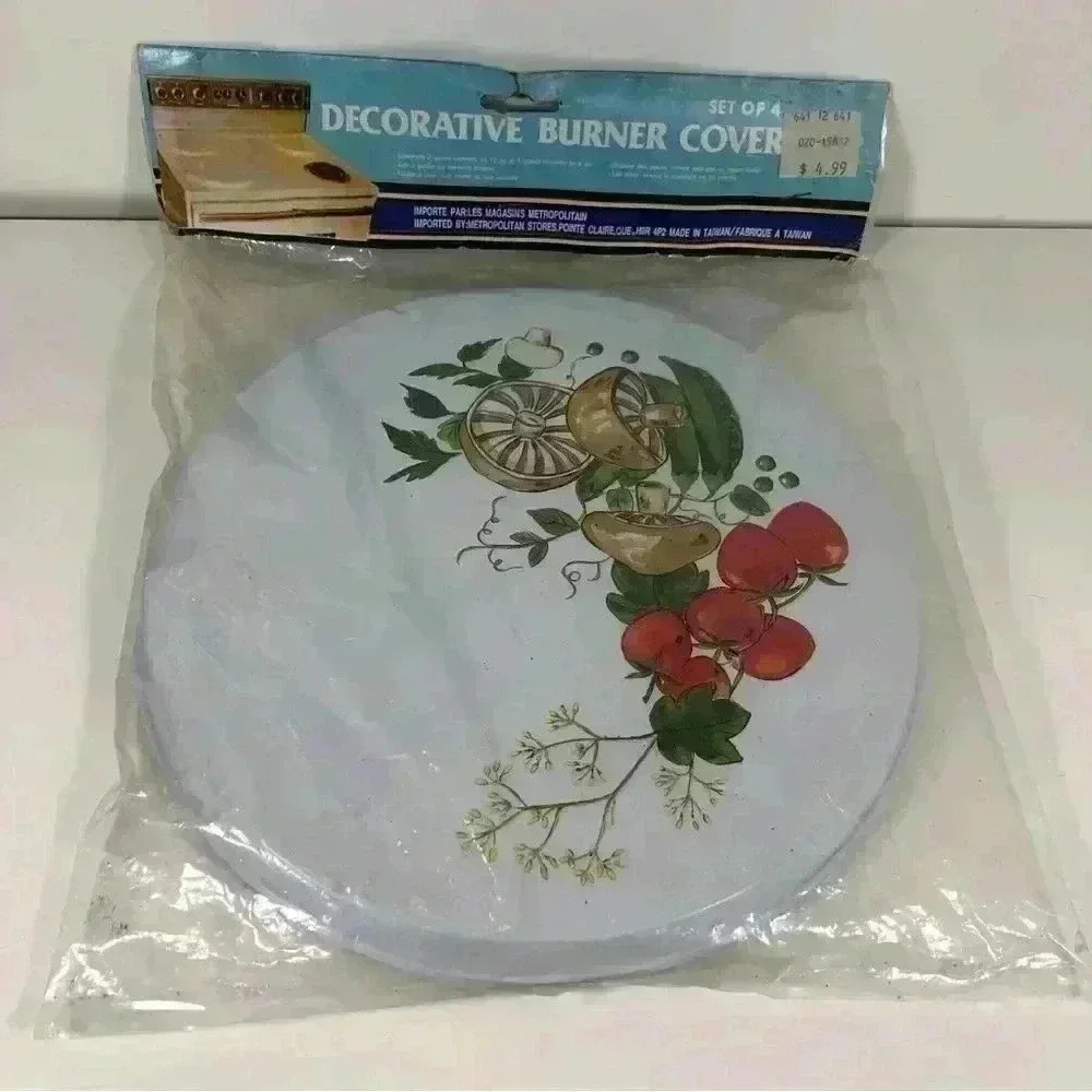 New in  package- set of 4 vintage decorative stove burner covers